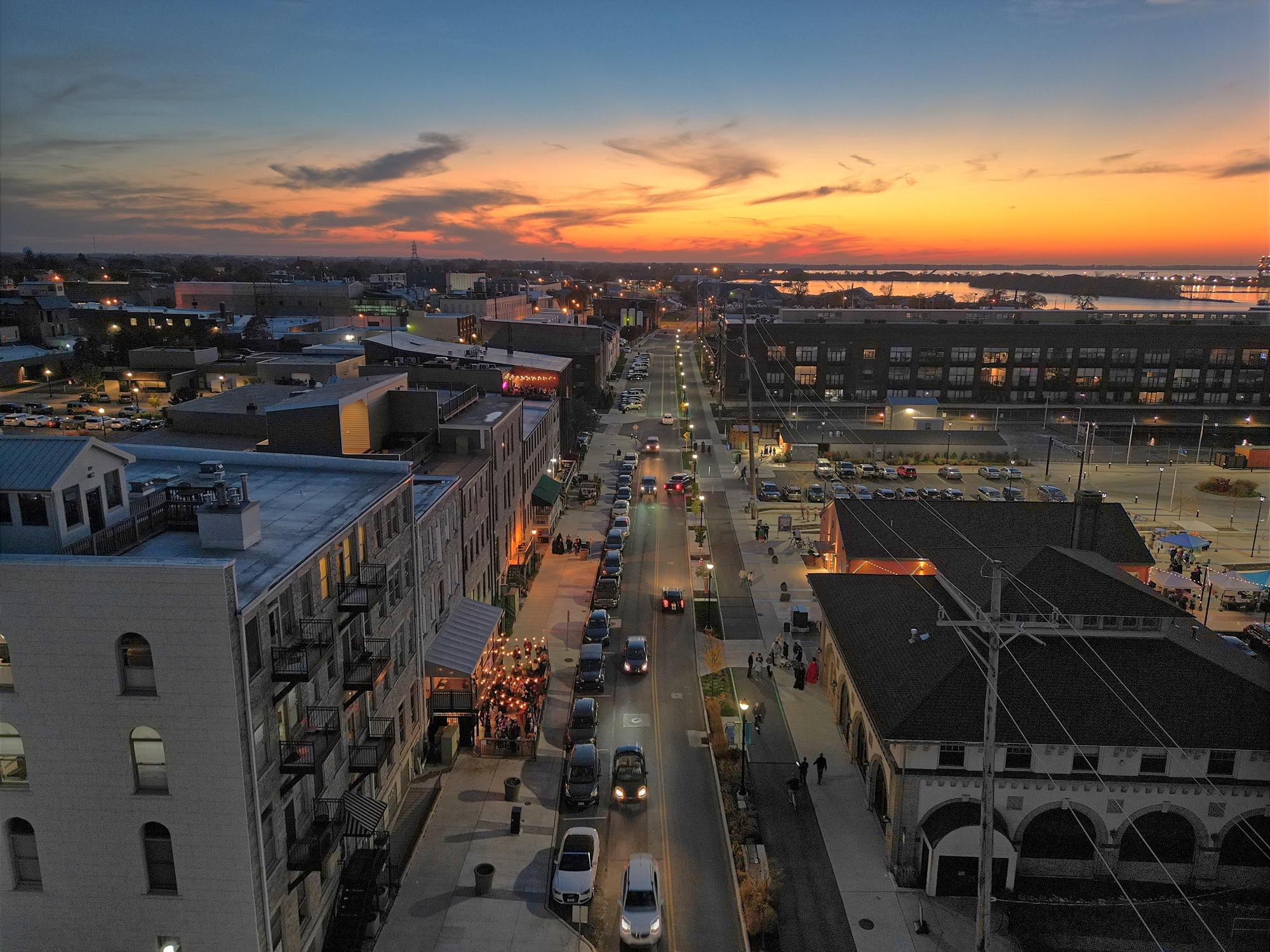 An aerial drone view of a city at sunset.
