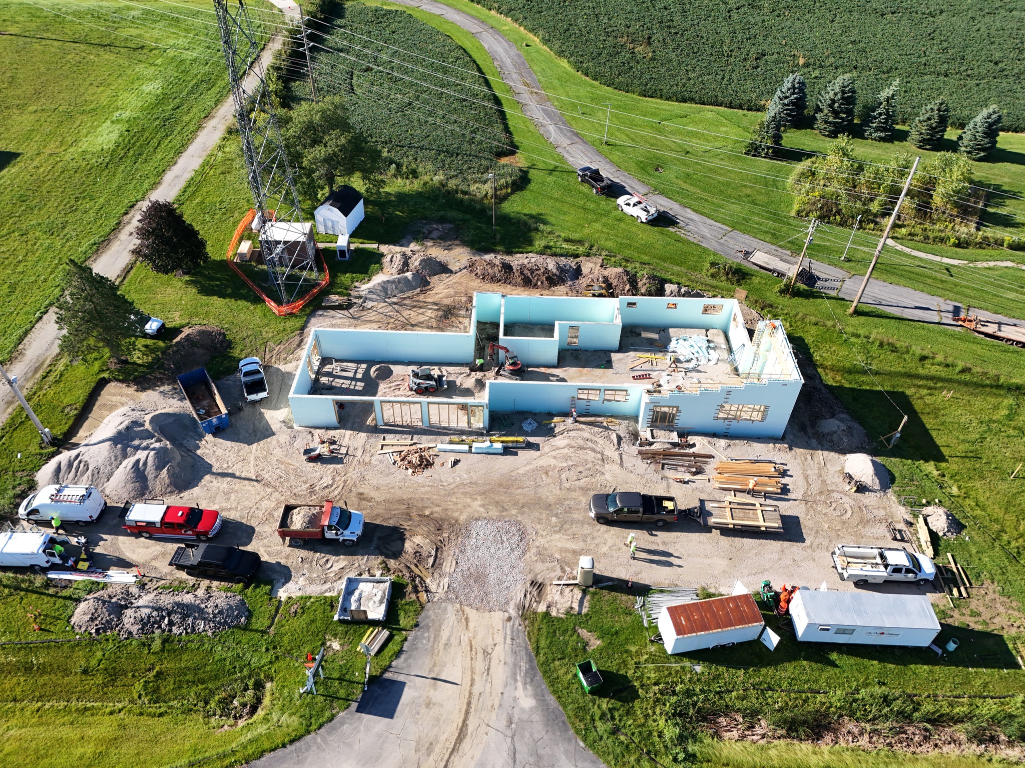 An aerial view of a house under construction captured by a drone.