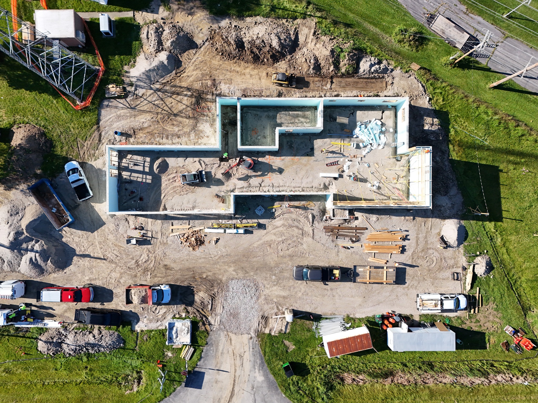 An aerial view of a house under construction captured by a drone.