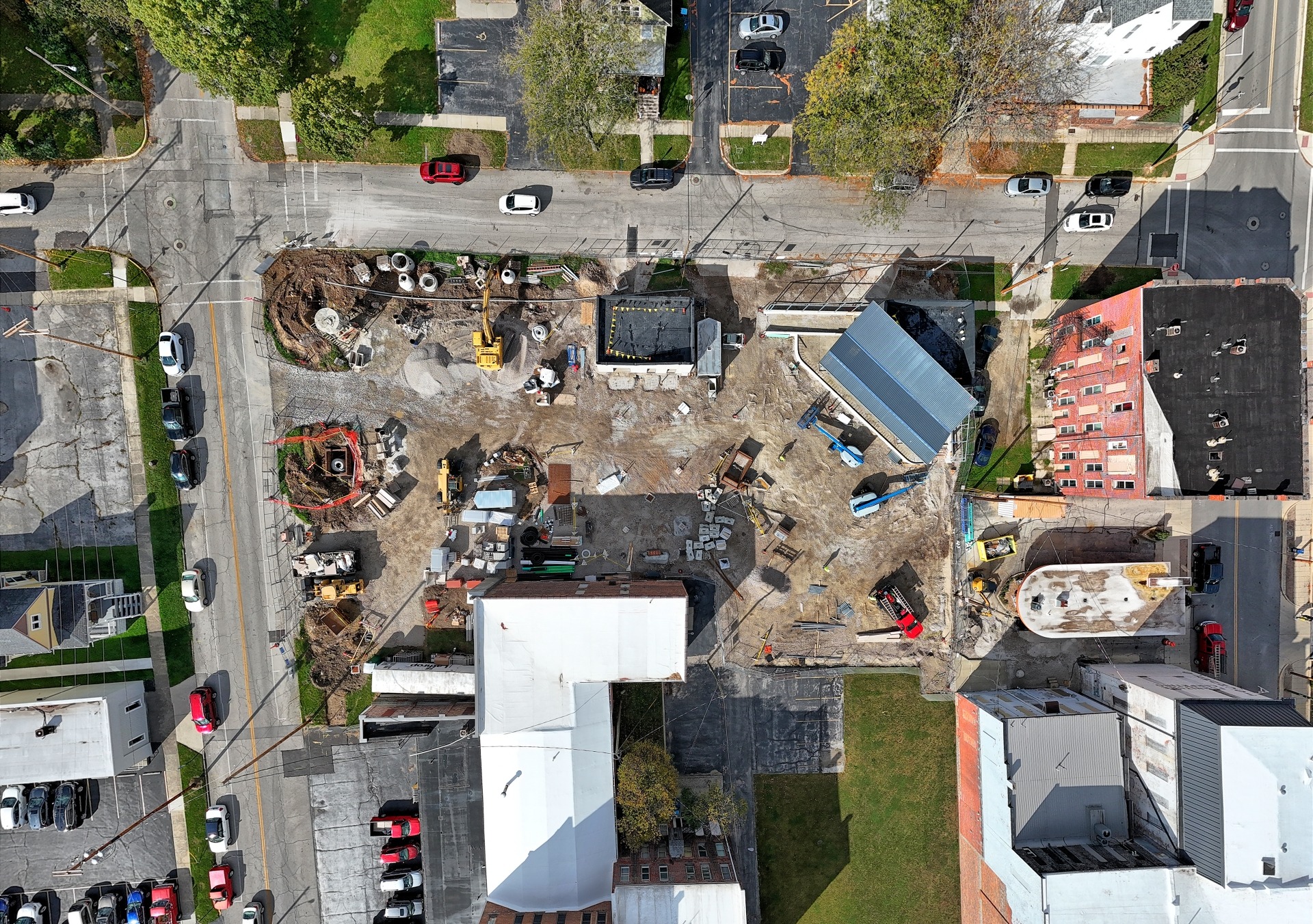 Aerial view of a construction site undergoing inspection, showcasing ongoing construction activities.